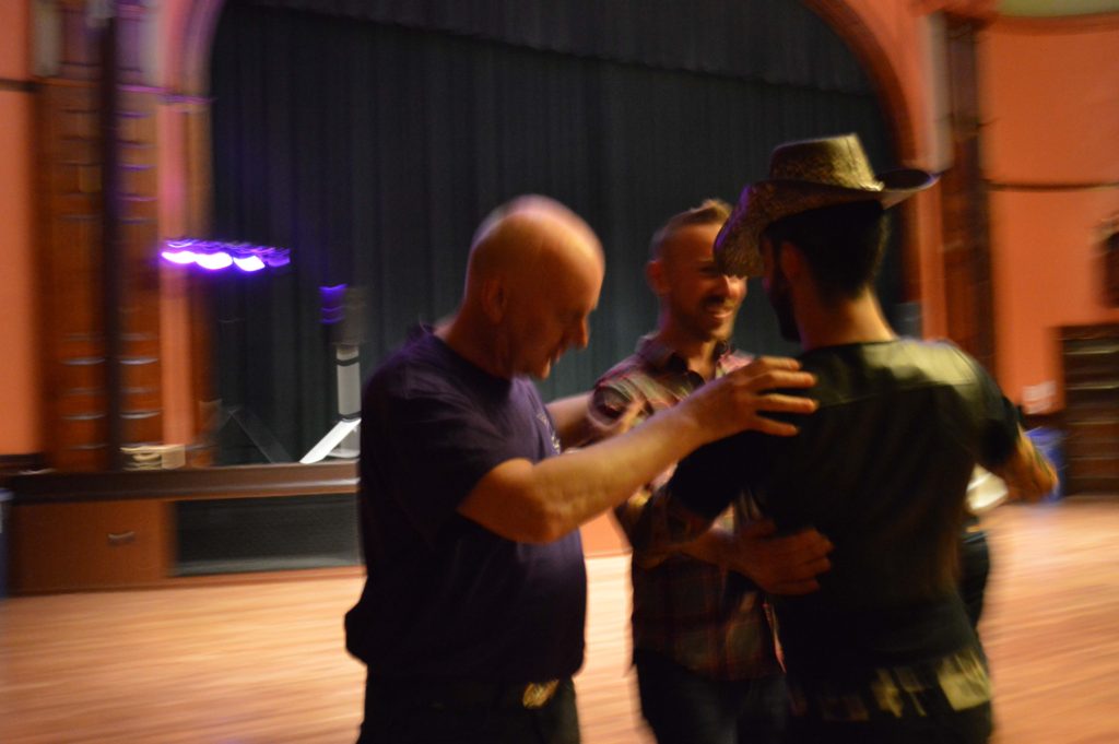 Photo from Stomp 2015 Saturday Benefit Dance with Art Sullivan a teaching Basic Two Step lesson.